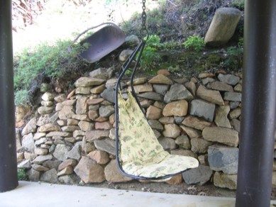 View of the swinging chair in the carport